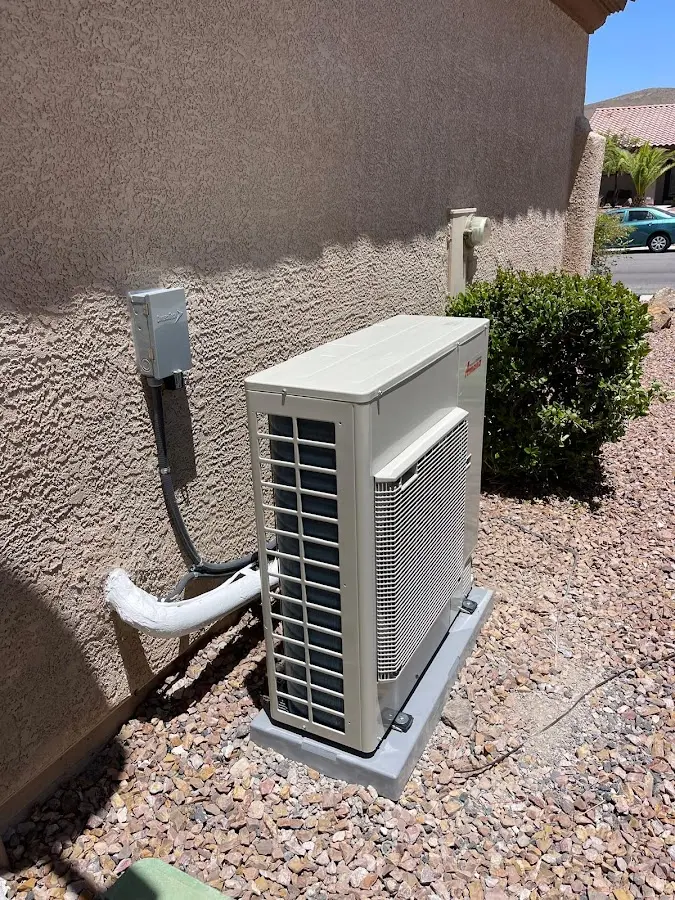 Residential air conditioning condenser unit in Lansing